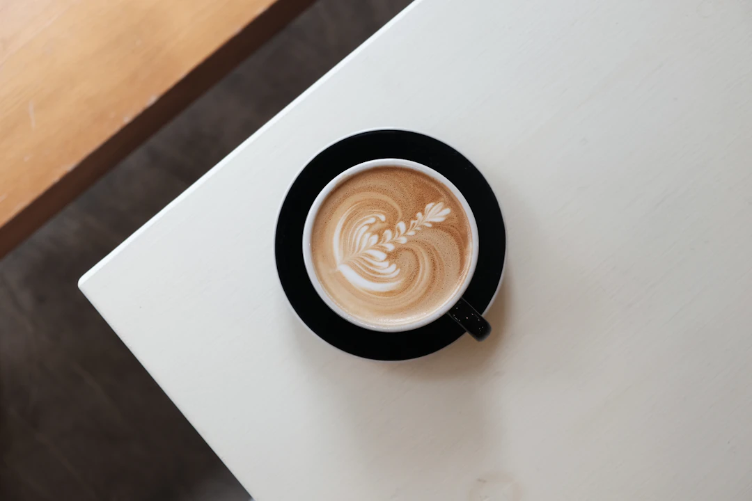 One cup of coffee on a light surface.